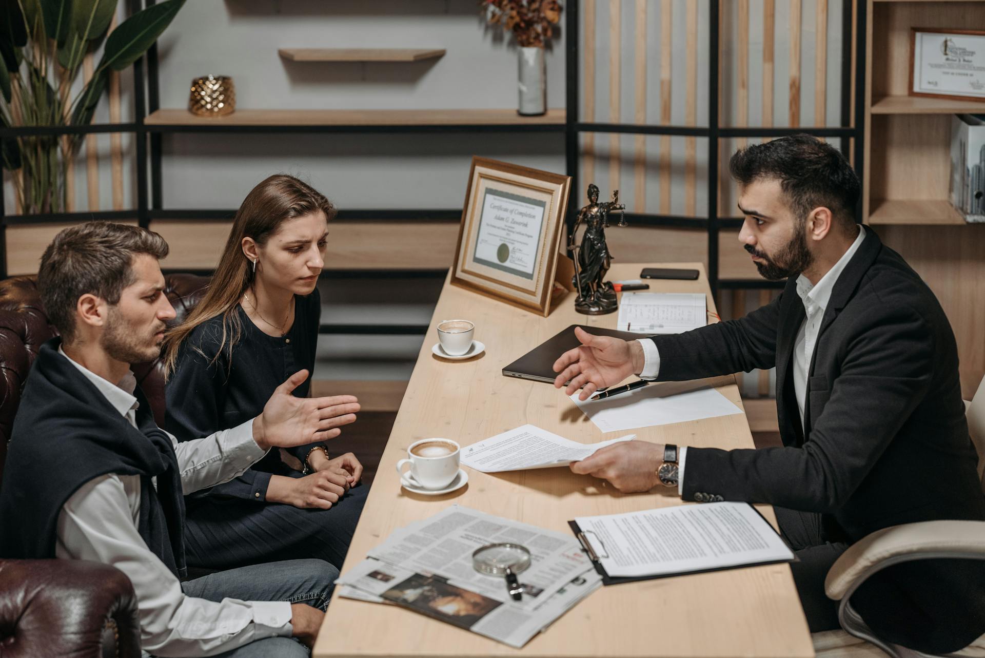 Attorney consulting with client in an office