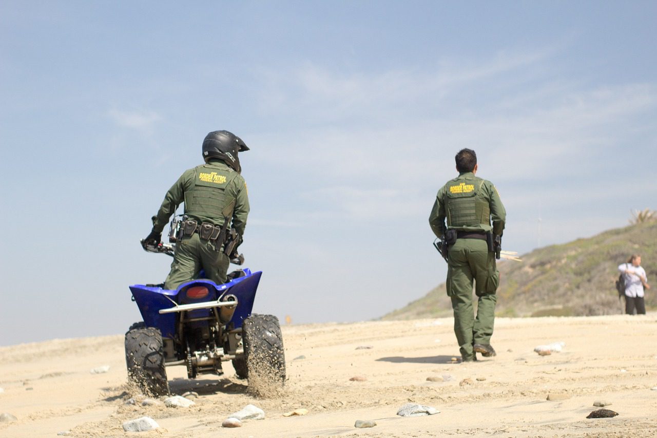 Border patrol agents confronting illegal aliens 