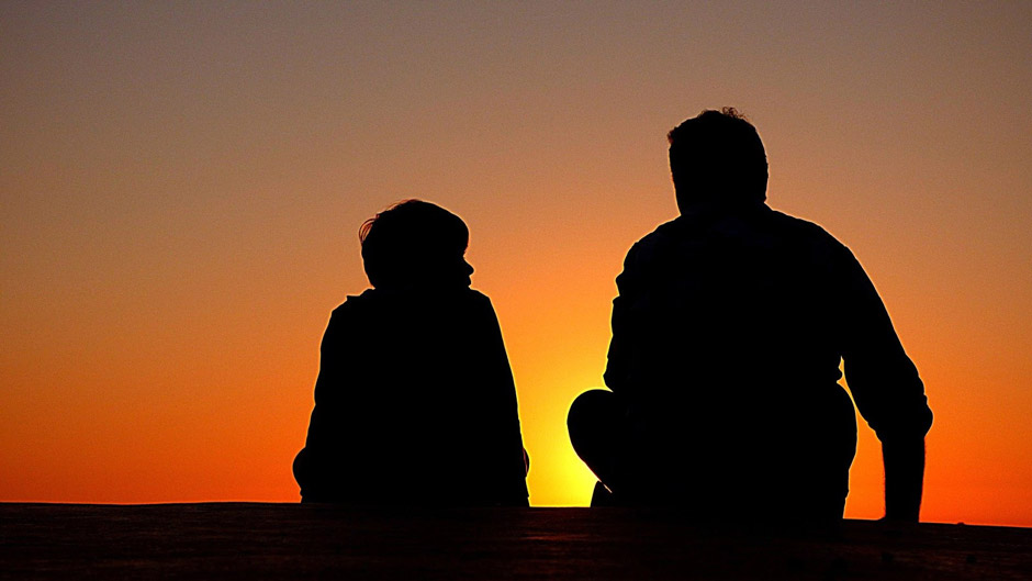 Silhouette of a father with son after a divorce
