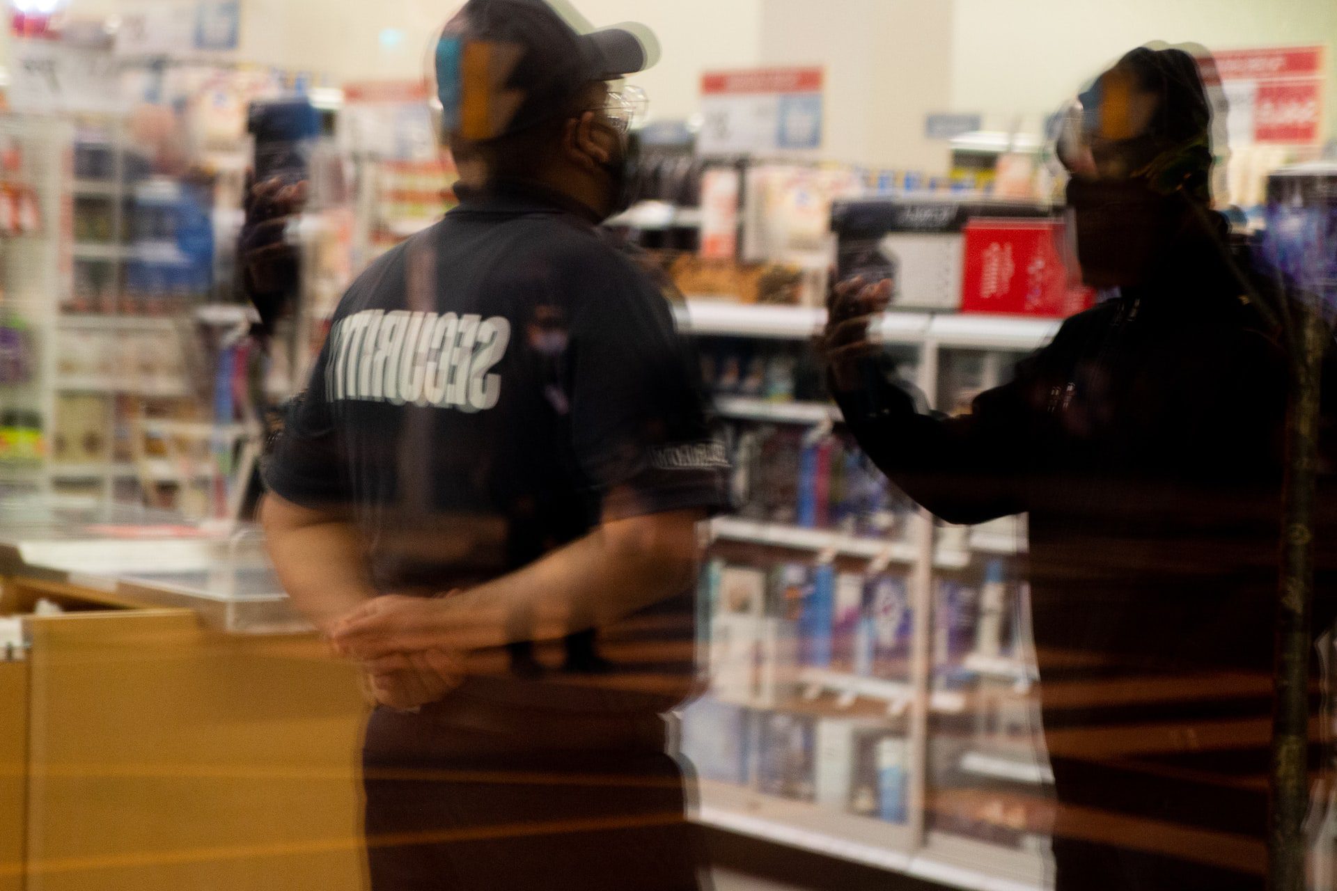 Security guards at a grocery store monitoring for theft risk, a sometimes nonviolent crime charge in California