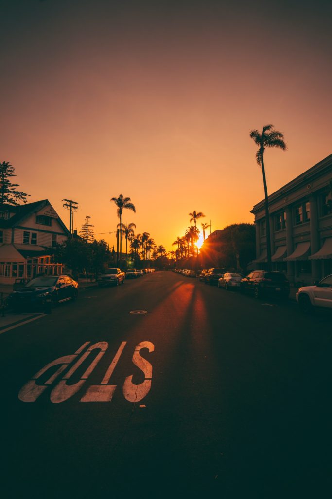 San Diego neighborhood street with a stop sign at sunset