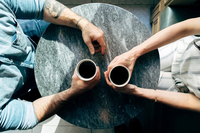 A couple mediating their relationship issues over coffee